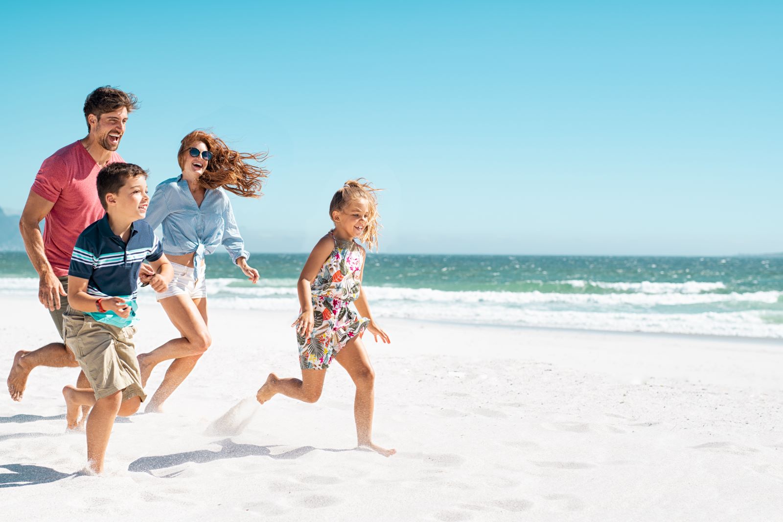 family running on madeira beach